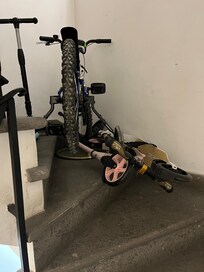 Bikes across the stairs of the annex to prevent intruders going further up the stairs