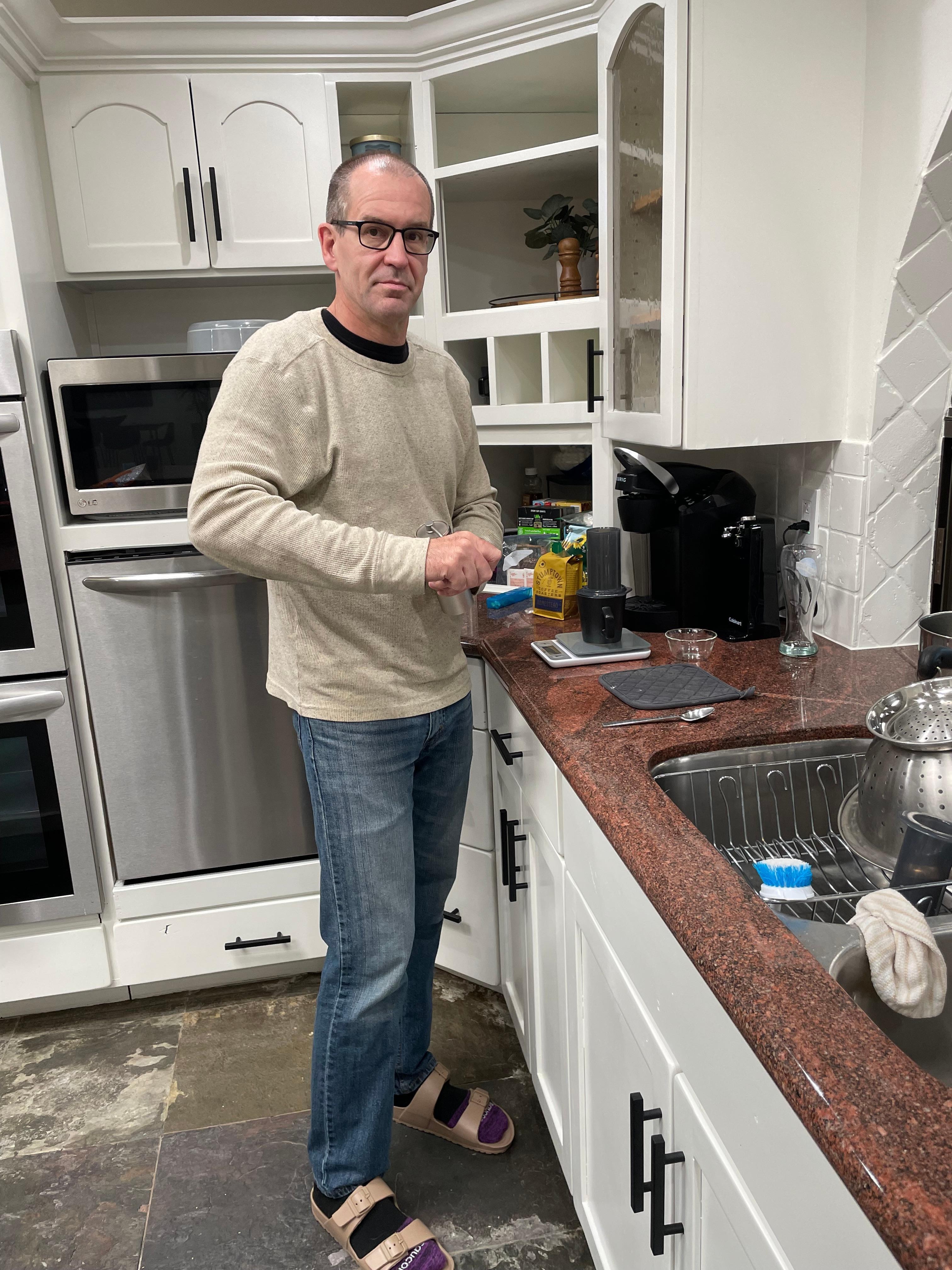 Mark making his special coffee using the scale Tess purchased for us to use.