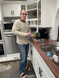 Mark making his special coffee using the scale Tess purchased for us to use.