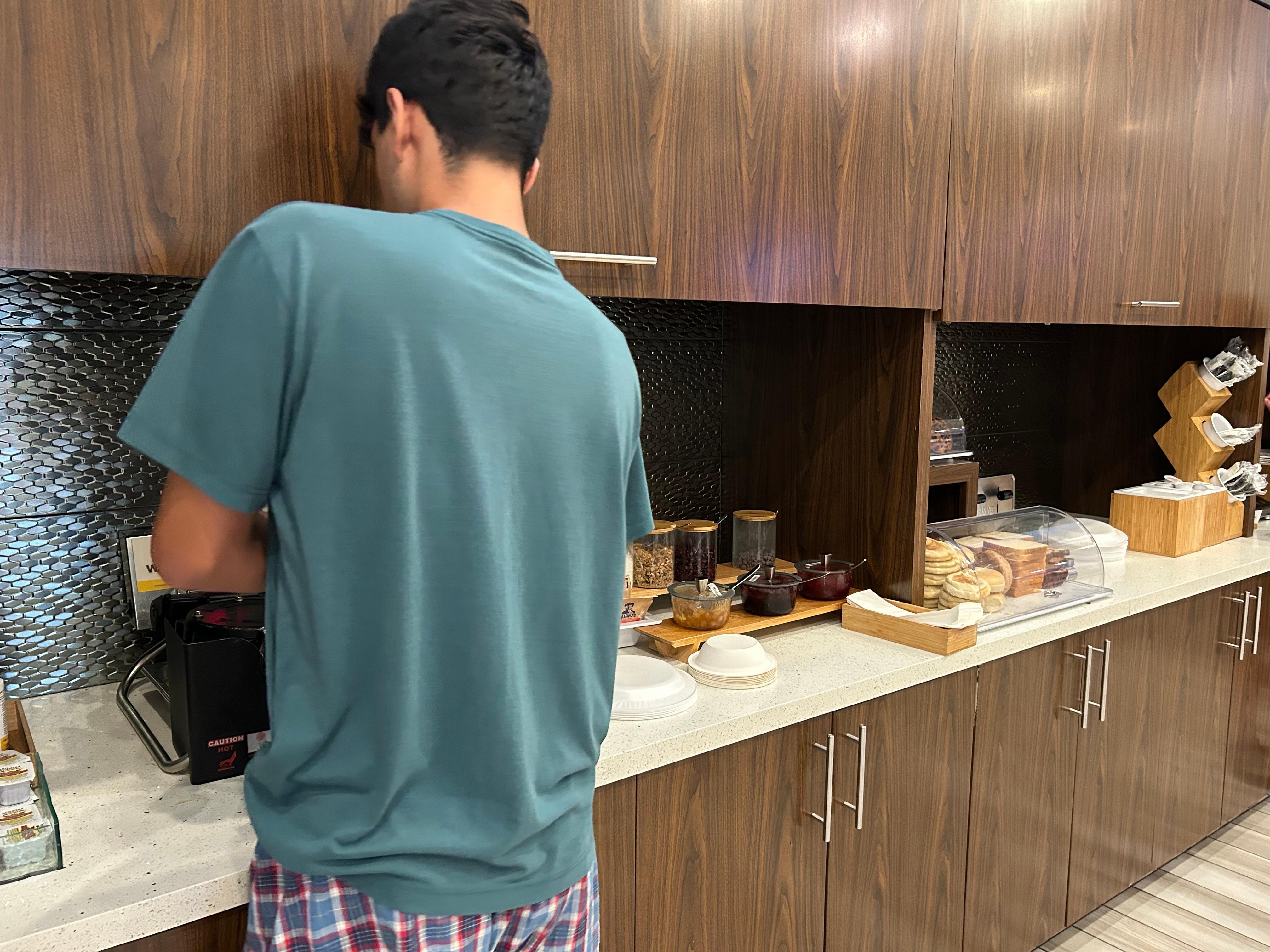 Grandson cooking his own waffles. Very proud of him, he is autistic.