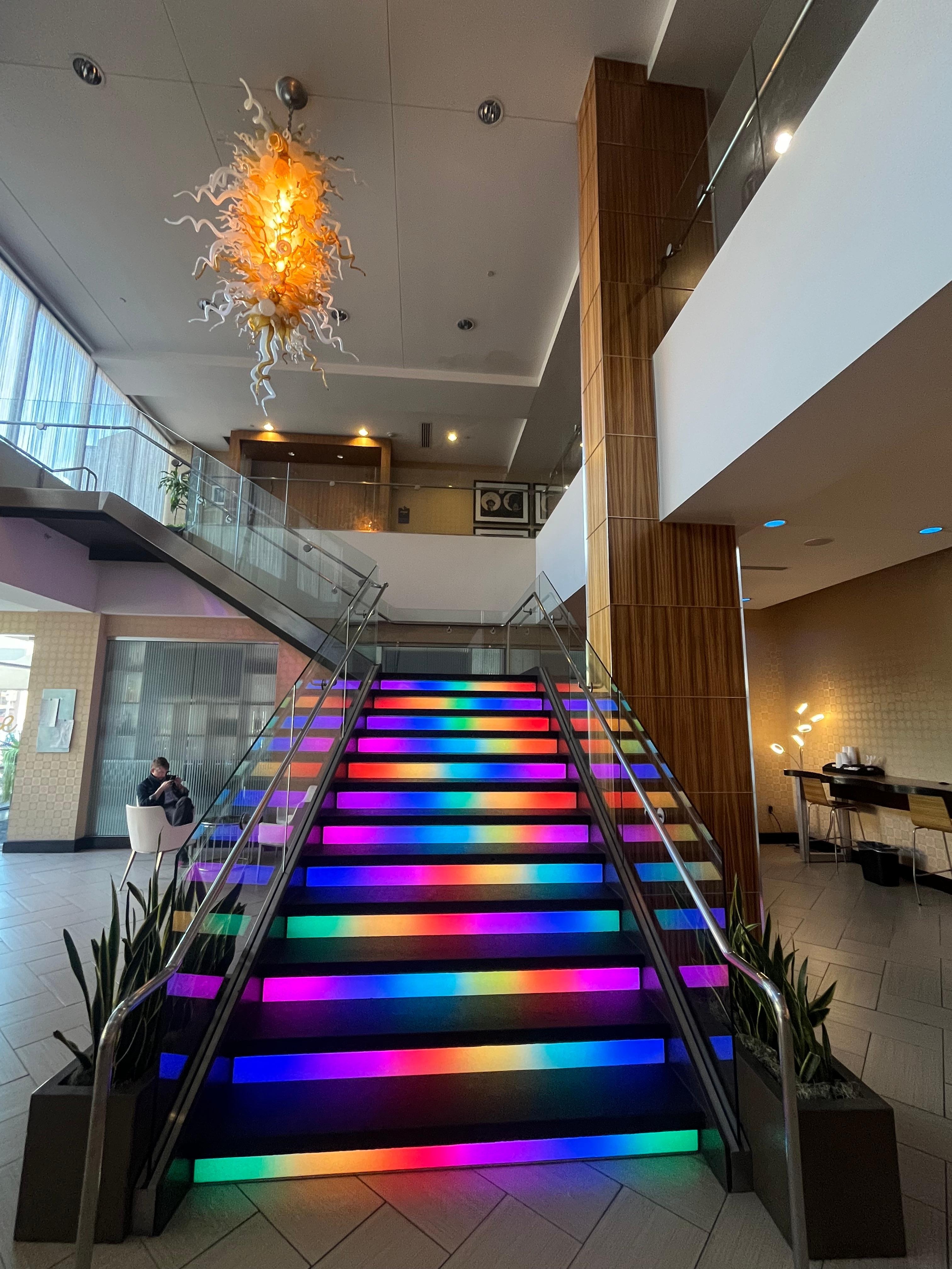 Rainbow stairs and cool chandelier!