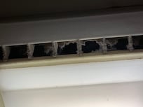 Filthy exhaust fan inside shower