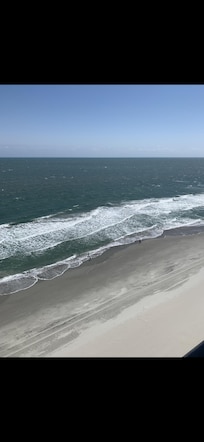 View of beach from balcony.
