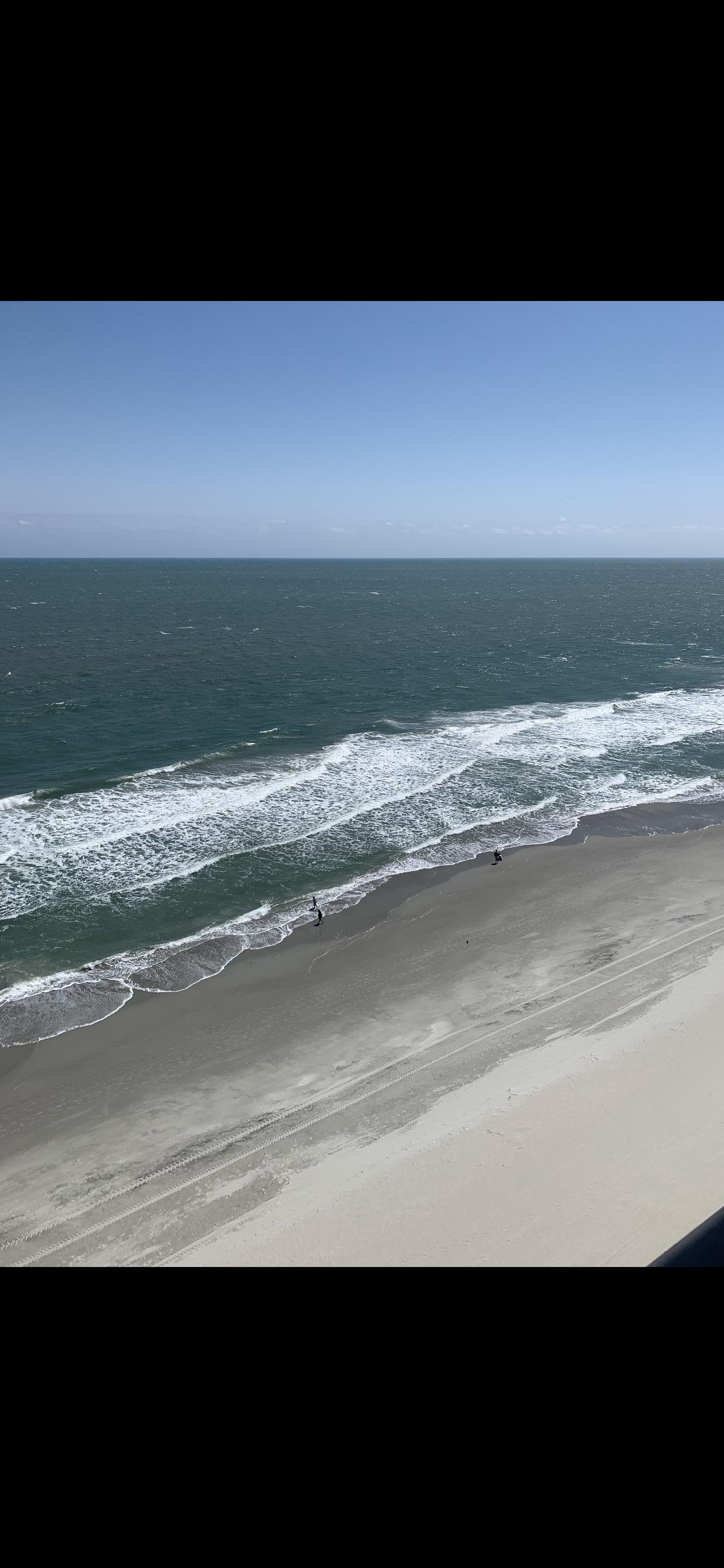 View of beach from balcony.