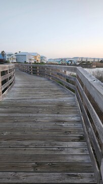The boardwalk.  Leads into a bike path that goes to the bridge/inlet between lagoon and gulf side.  Great place to take a walk!