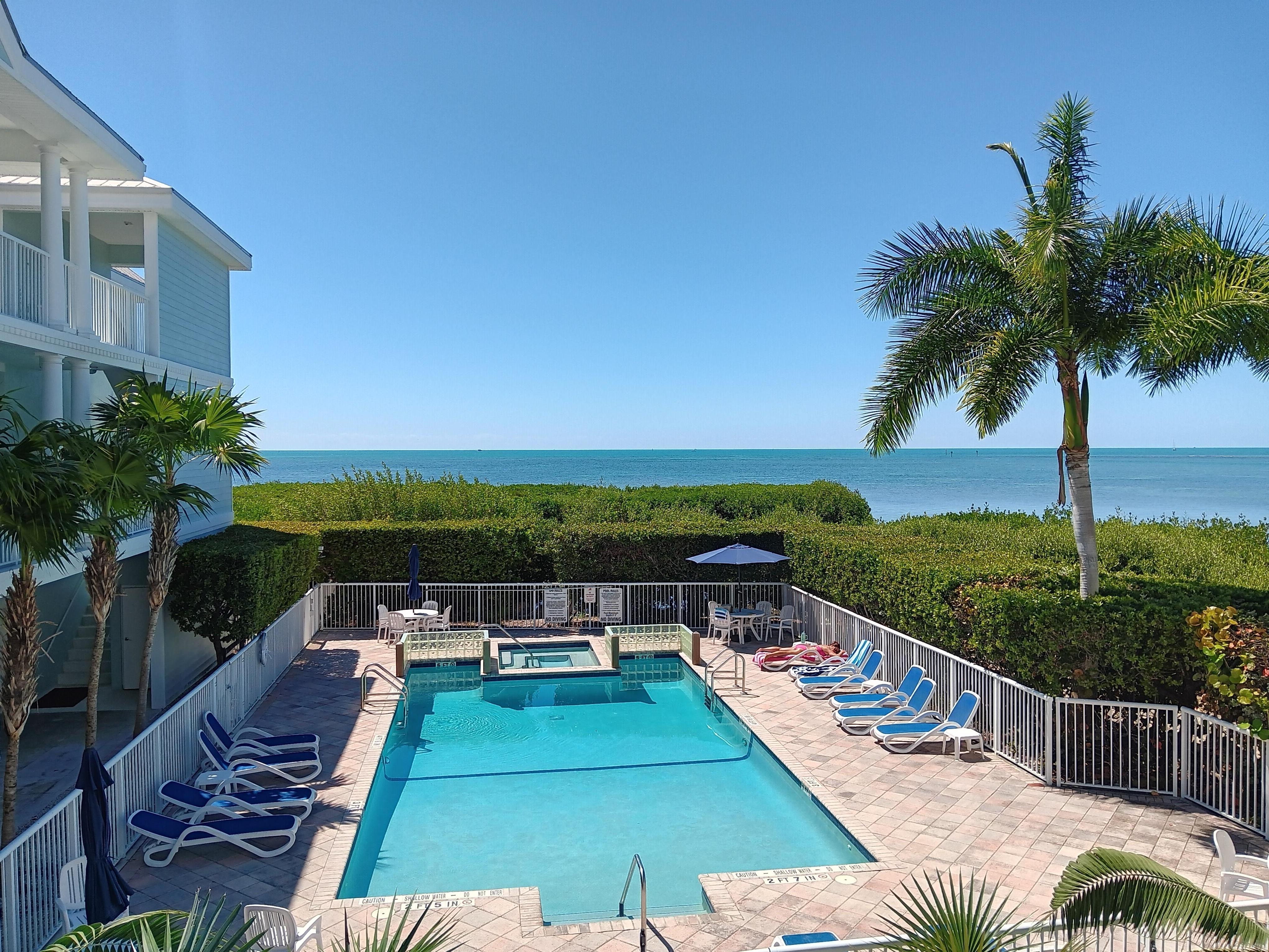 View of pool and ocean from the stairwell.