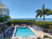 View of pool and ocean from the stairwell.