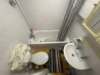 Your luxury shower with shower curtain installed within the bath!