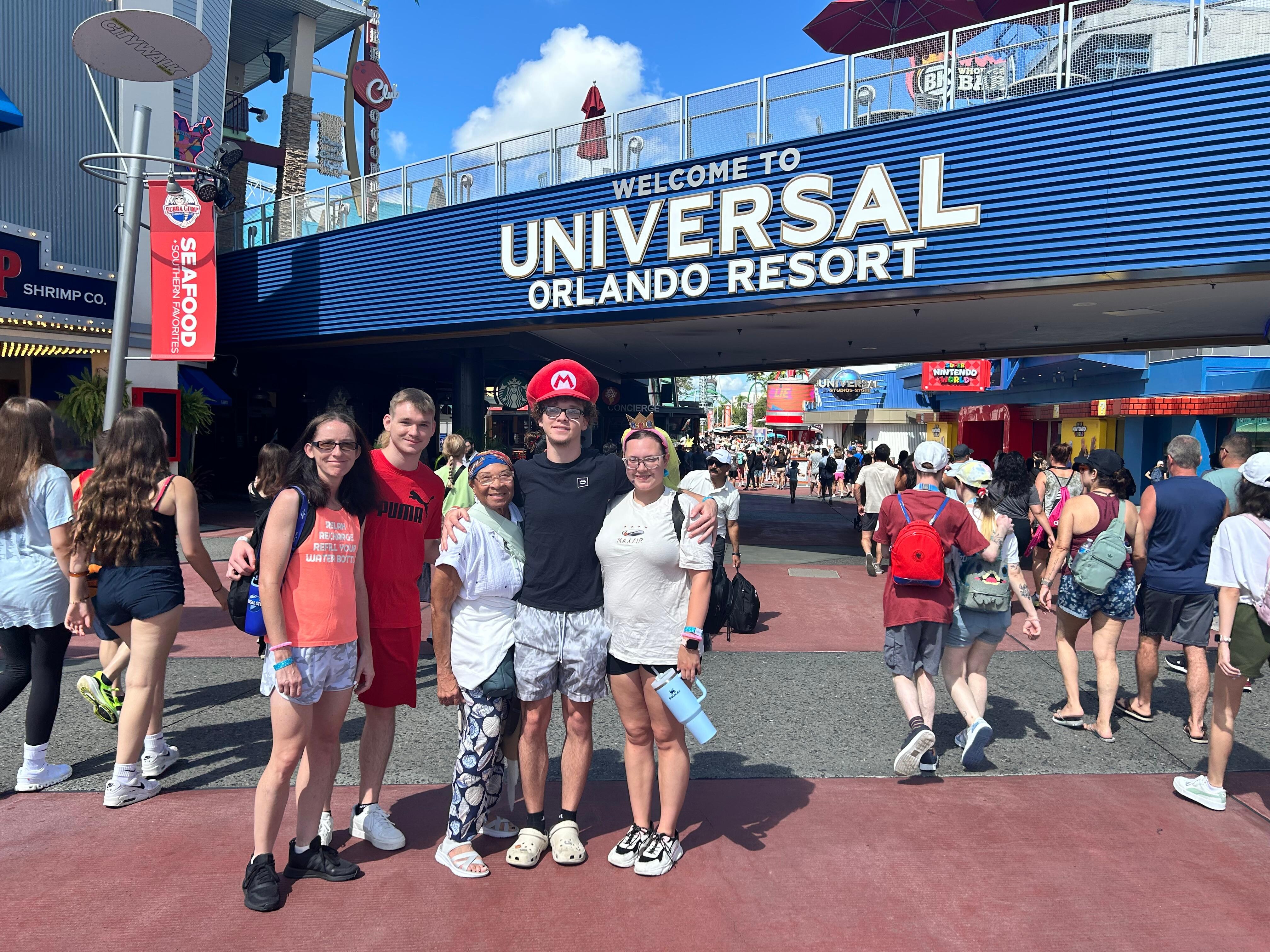 The entry to Universal Studios 
(left to right,)  Sara, Jordan, Patricia, Carson &  Mackenzie 