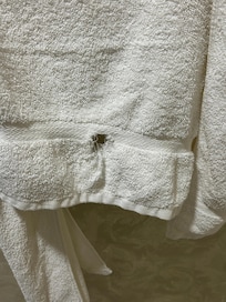 Holes in towels and “white” towels were brownish and stained