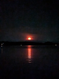 Have you ever watched the moon rise? This was a view of one, from the dock.