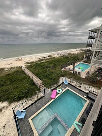 View from the balcony- pool, ocean, and private path to the beach