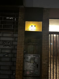 The entrance to the building is locked with bars. The hotel is on the 7th and 8th floors of an apartment building and you have to ring to be let in.