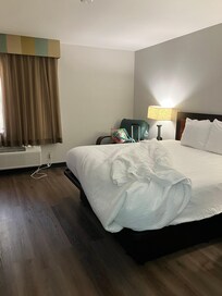 New flooring and bedding but old stinky curtains