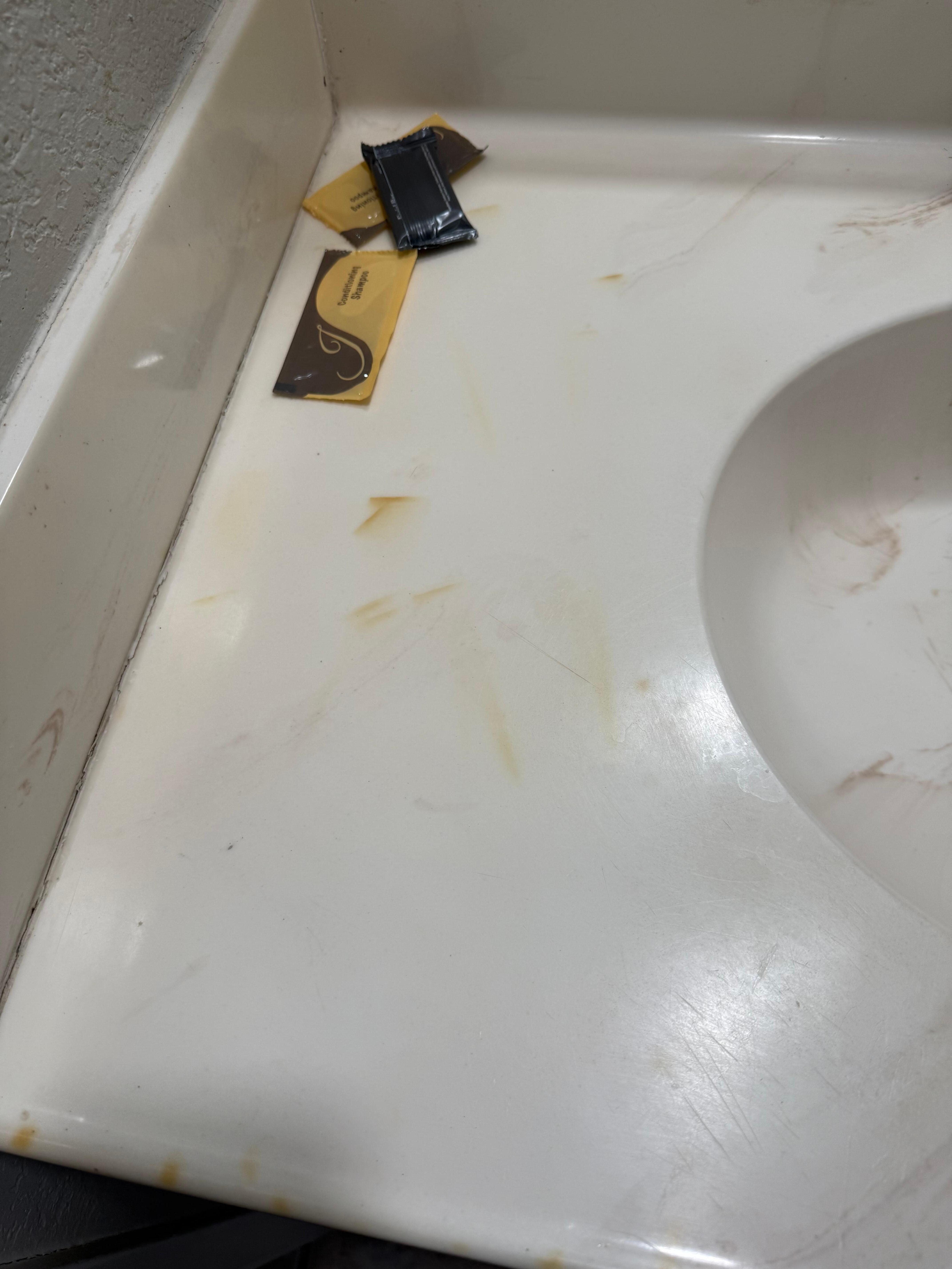 Hard to see but stains and hairs on sink