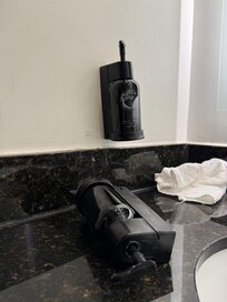 The hand soap bottle fell off the wall while we were out for the day.