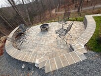 Well designed fire pit featuring the best view of the drive and property