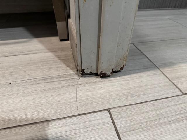 The doors within the room are in dire need of repair.