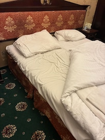 This is the state of the bed how we would find it upon return in the evening - never made properly