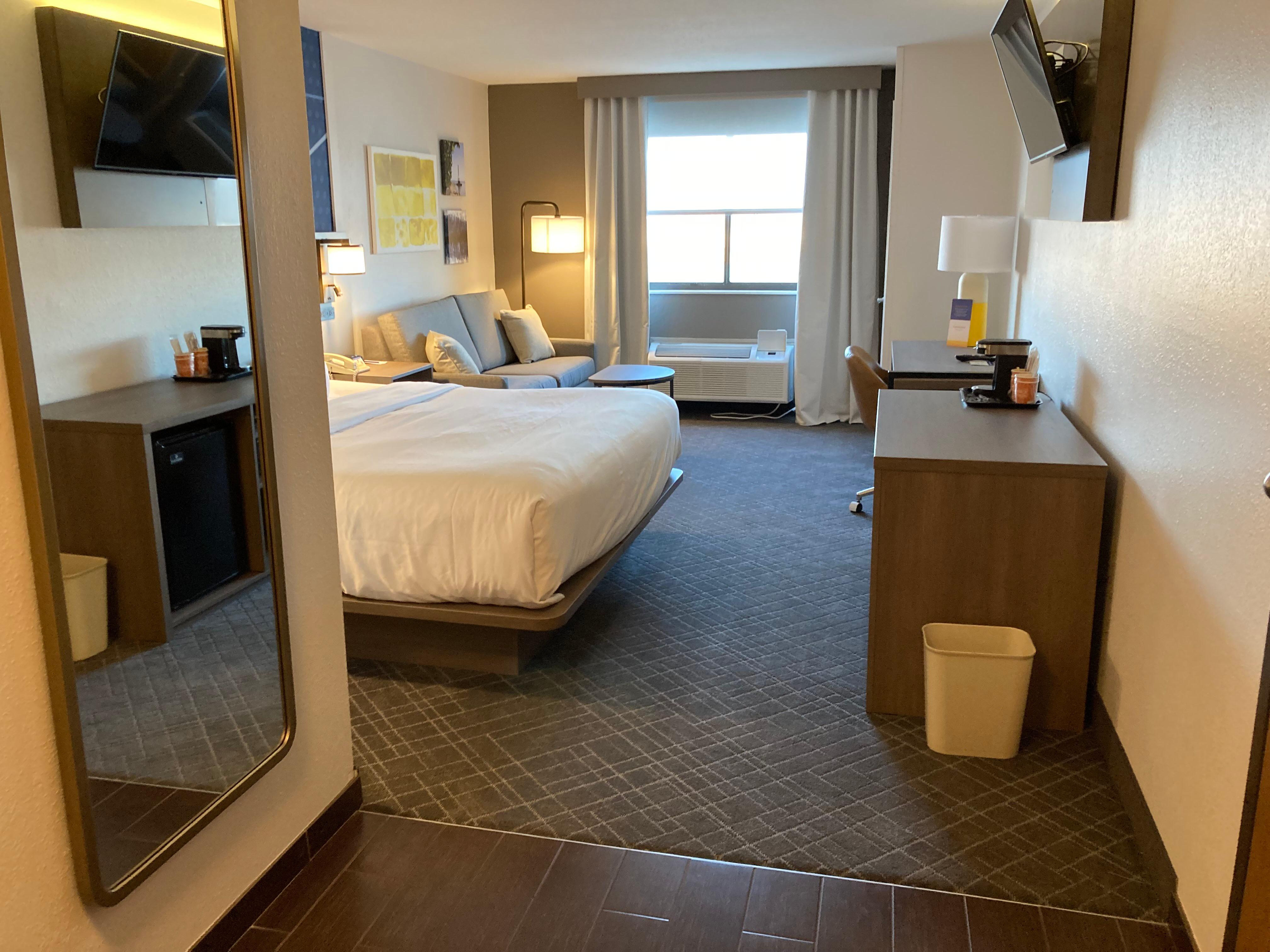 Photo of the room. The restroom is on the left out of frame. Nice sink, toilet, towels, shower, and lovely citrus mist shampoo, conditioner, and lotion.