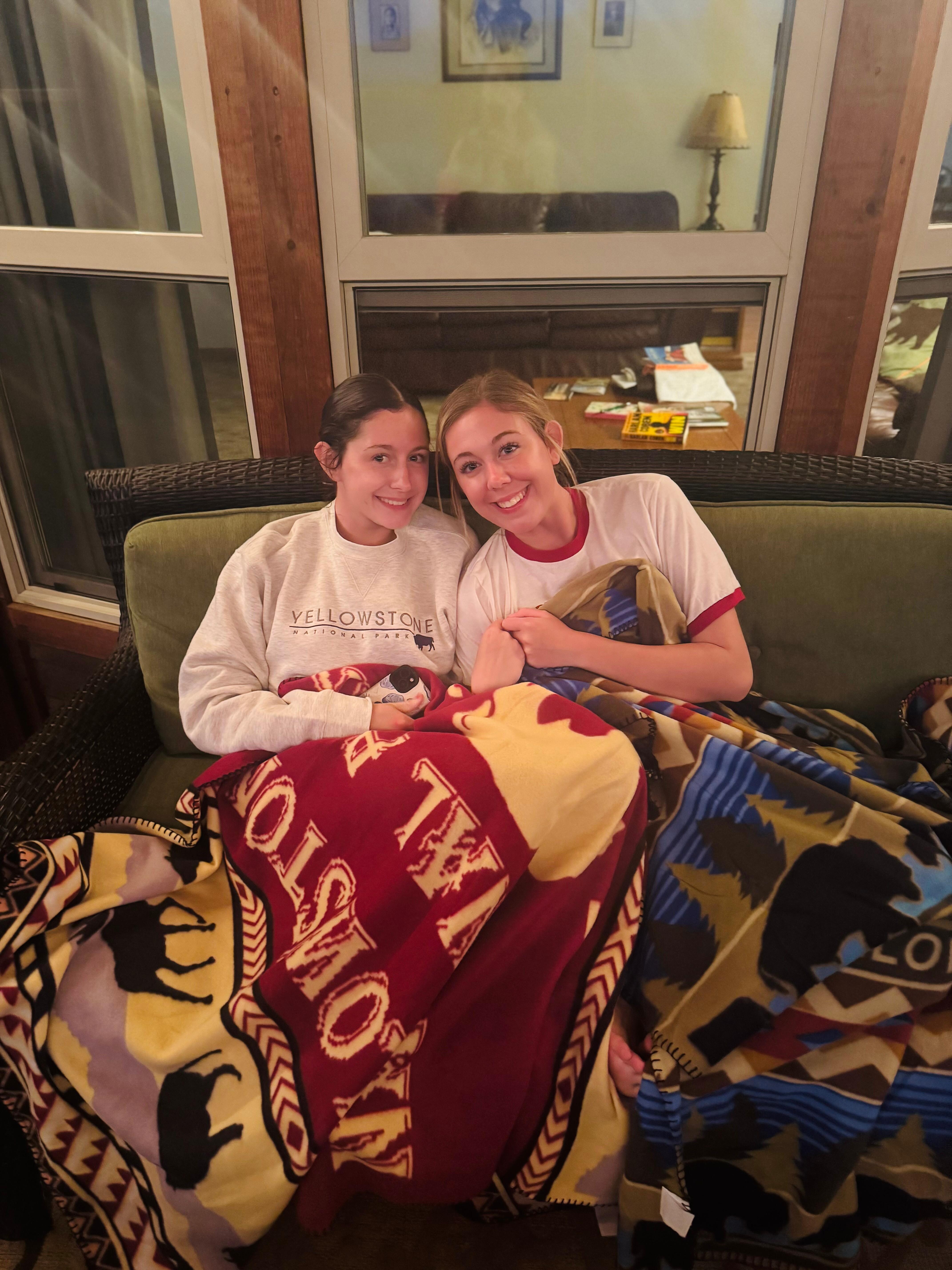 My nieces enjoying the porch with the gifts that the owner left them. 