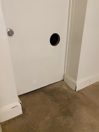 This door is literally a few feet from the bed. Who knows what creatures will visit you at night.