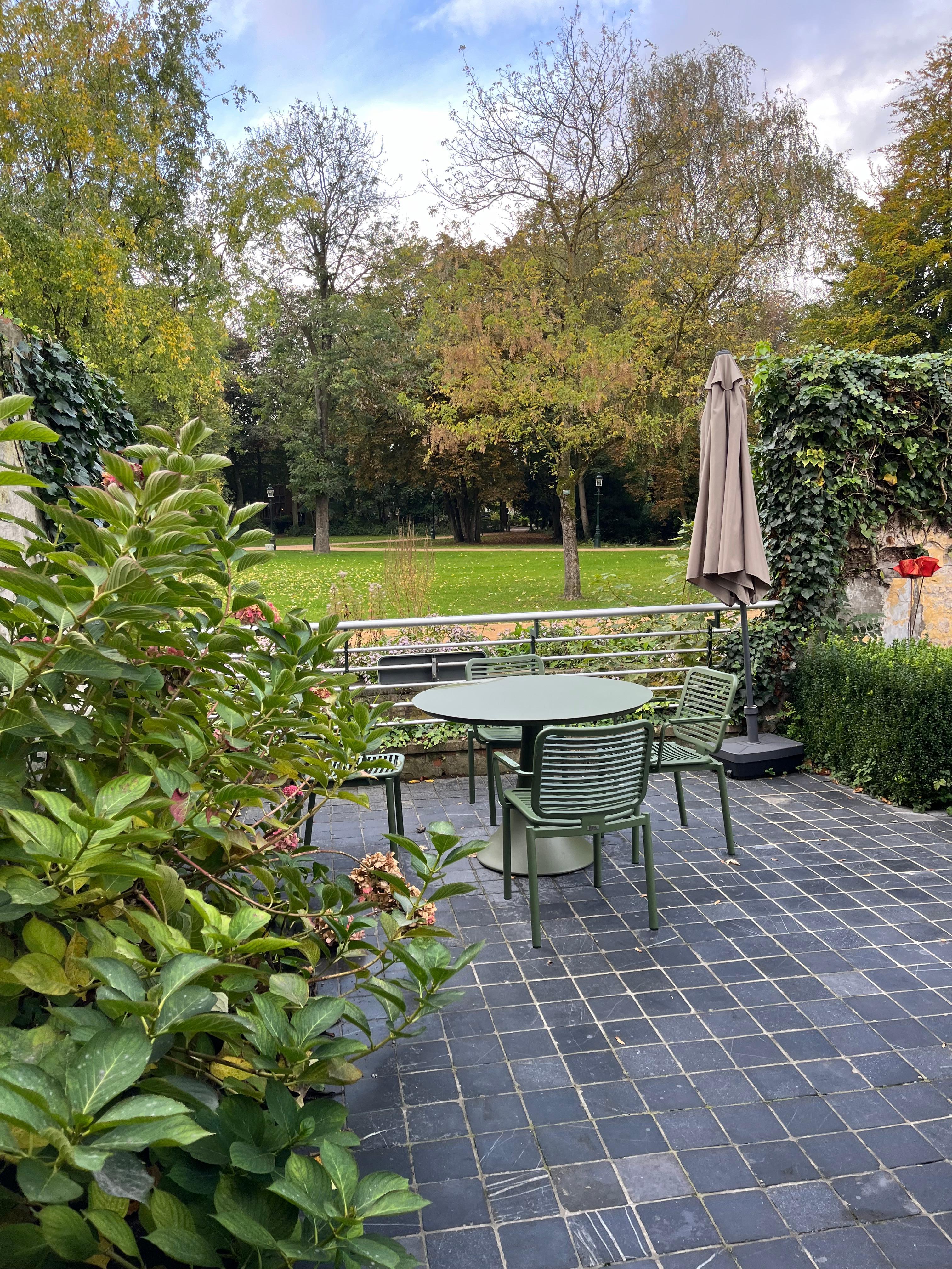 the back patio looks out over a canal into the park. 