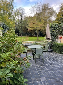 the back patio looks out over a canal into the park.