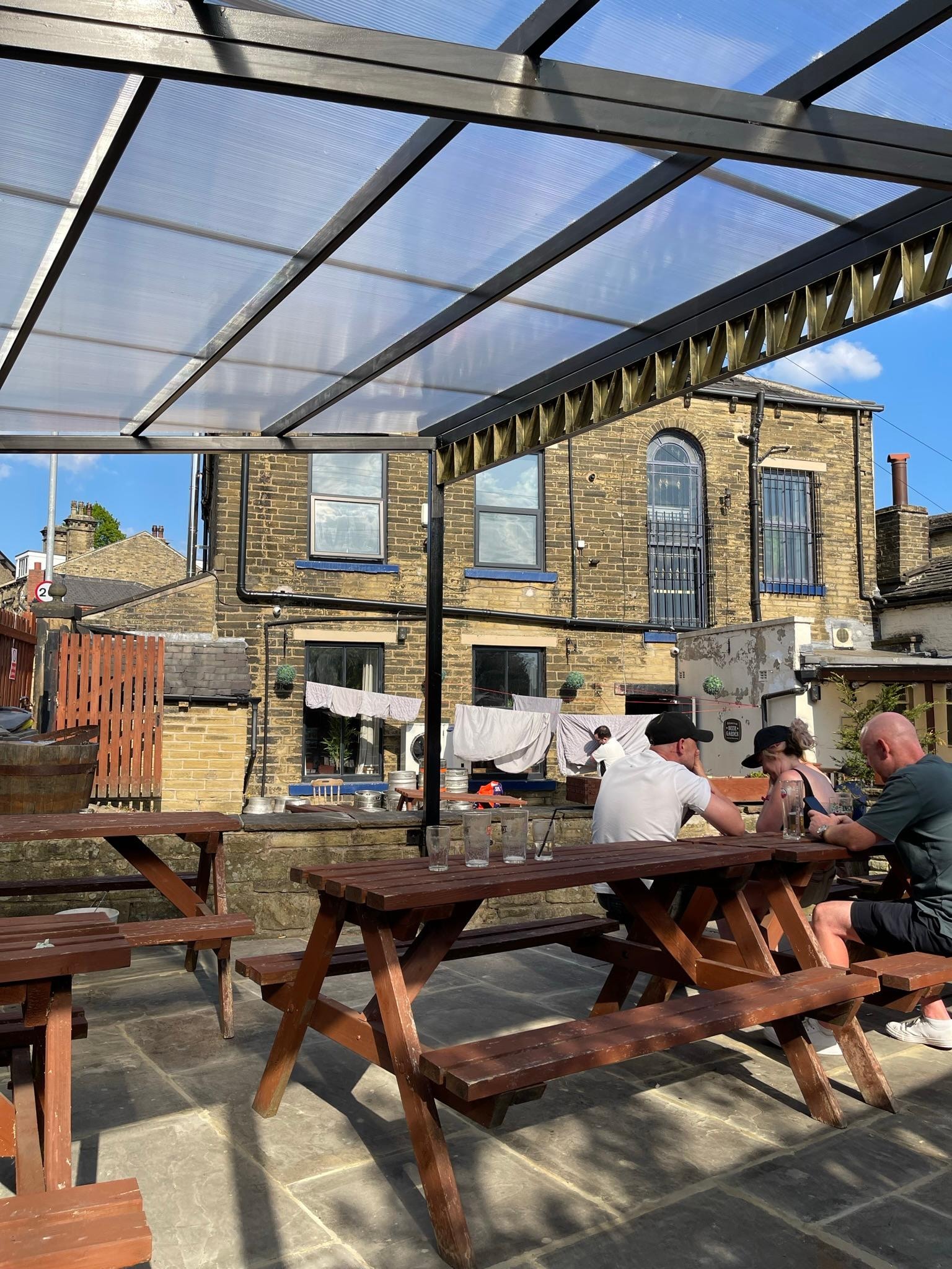 The beer garden with Jamie hanging out washing! Good man!
