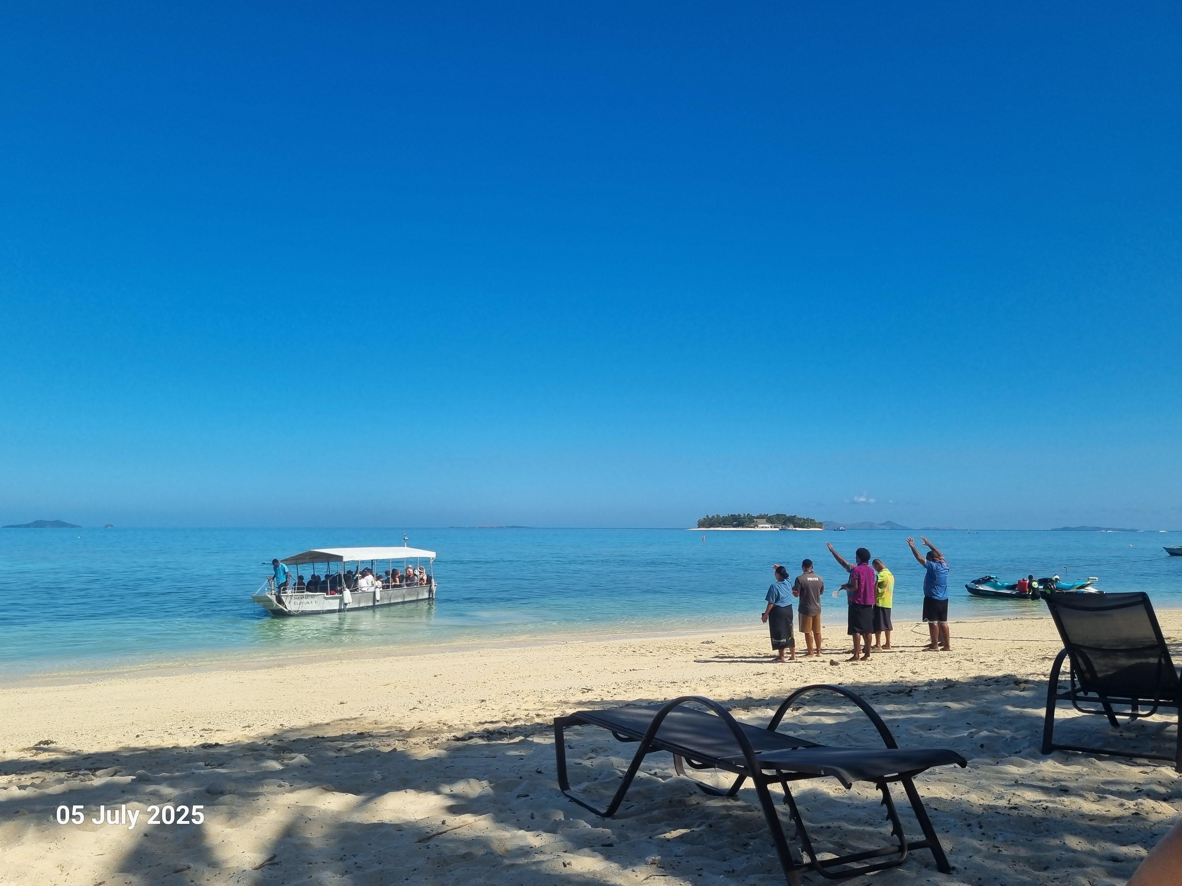 The staff singing the Fijian Farewell to visitors leaving the island