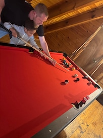 The guys playing pool upstairs