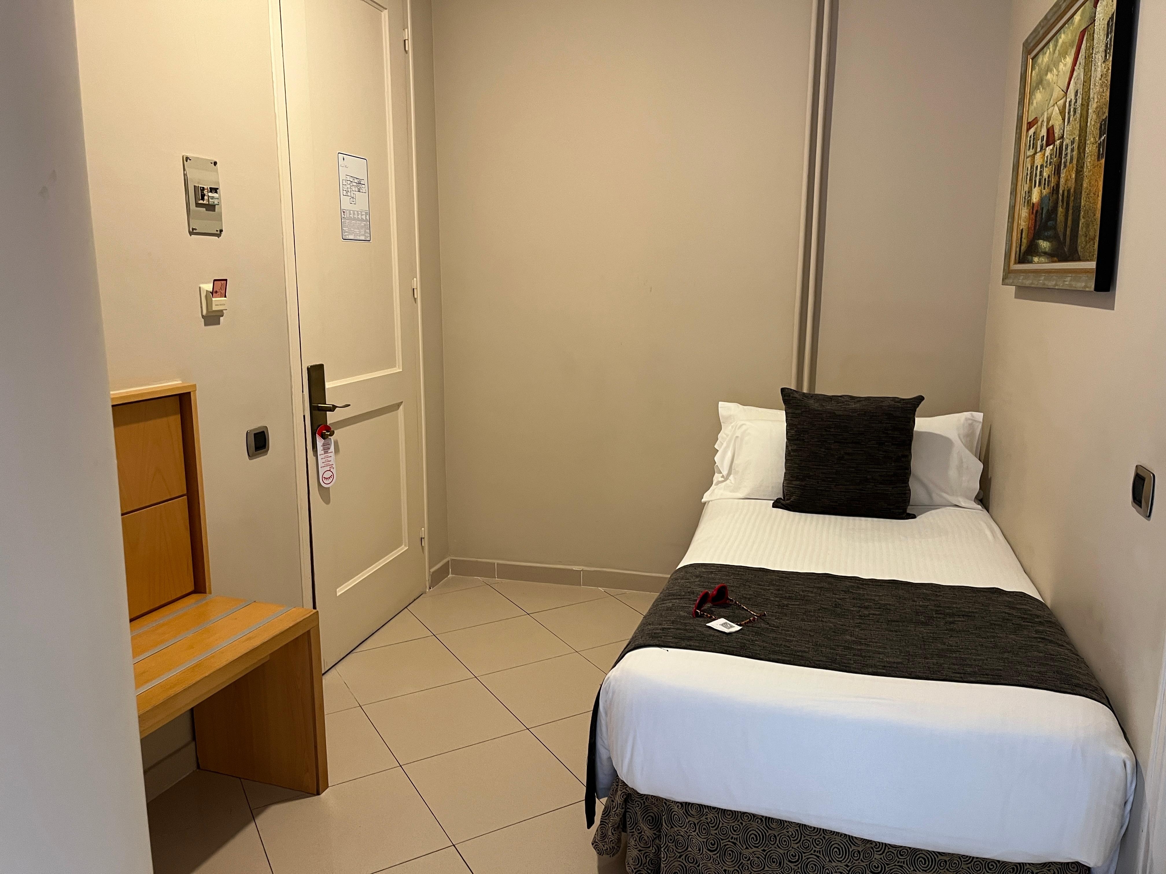 One of three beds in the room, they had a little set off area of their own near the loo