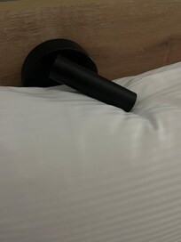 Weird design flaw, pillow and light fight for space.