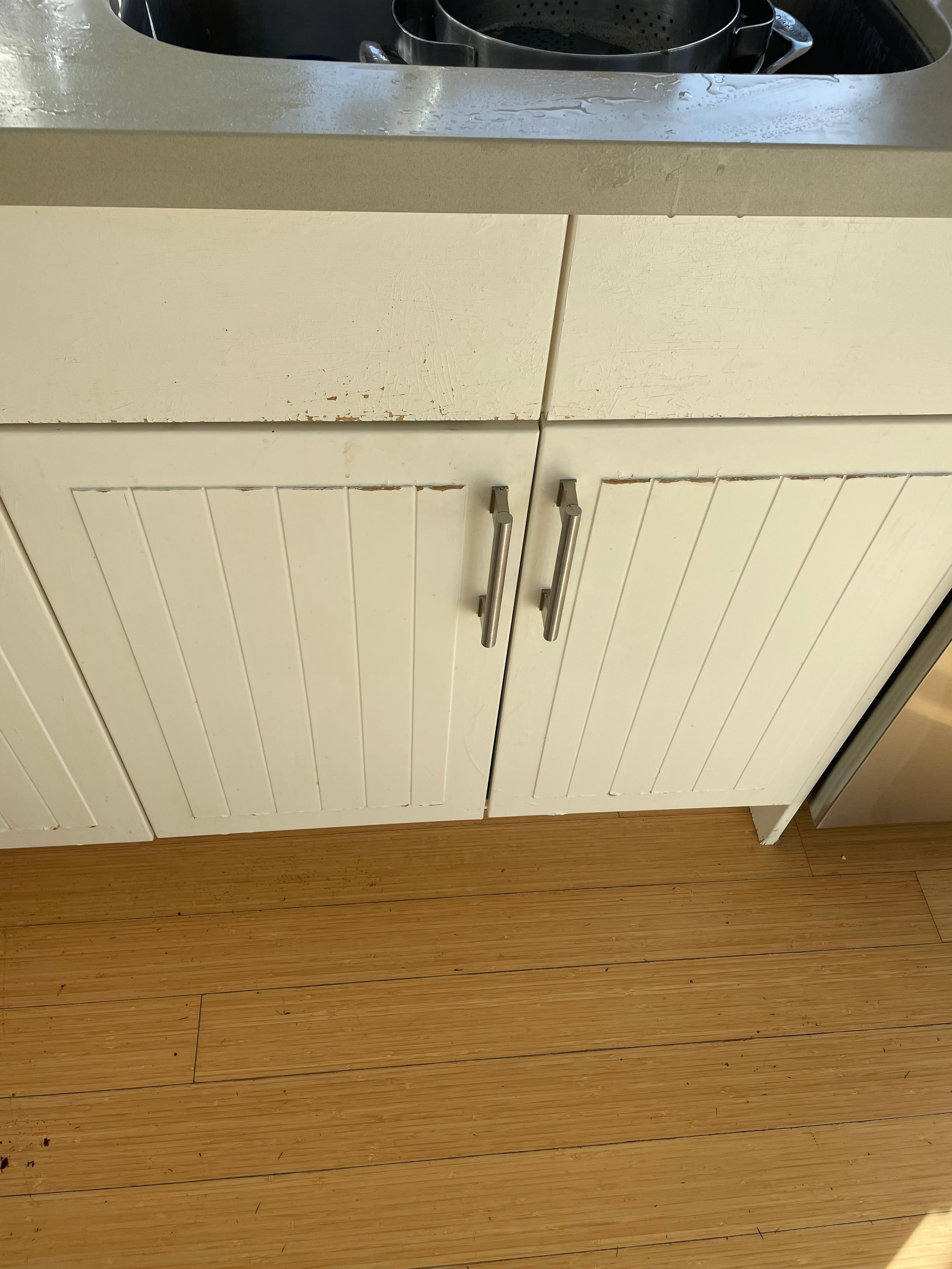 Peeling paint on kitchen cabinets
