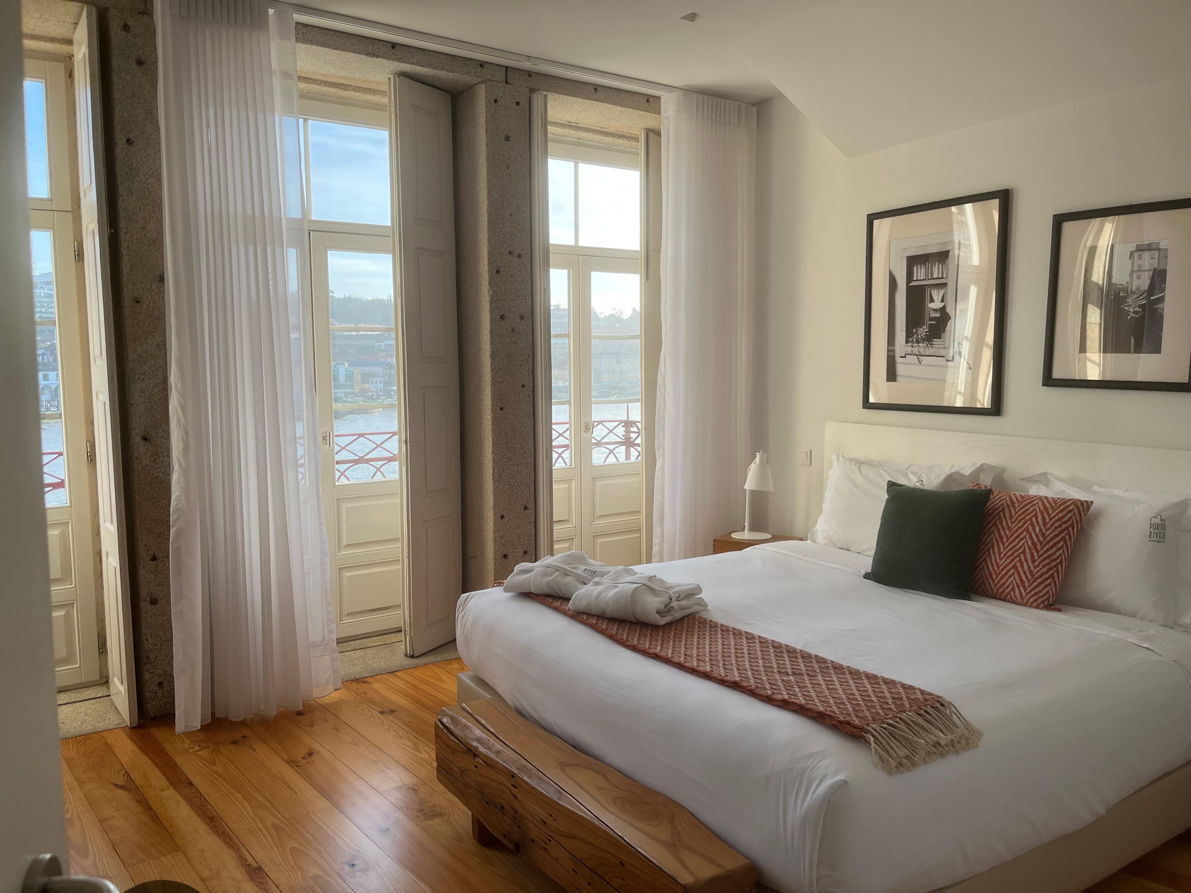 River View Balcony Apartment, bedroom toward the bedroom’s balcony.
