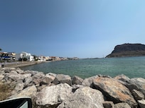 The tavernas along the water, with Monavasia views.