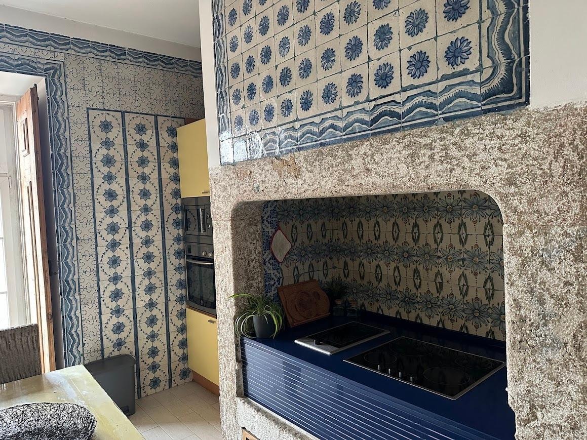 Kitchen cooking area with original tiles