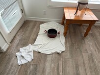 Kitchen pot and towels to contain leak