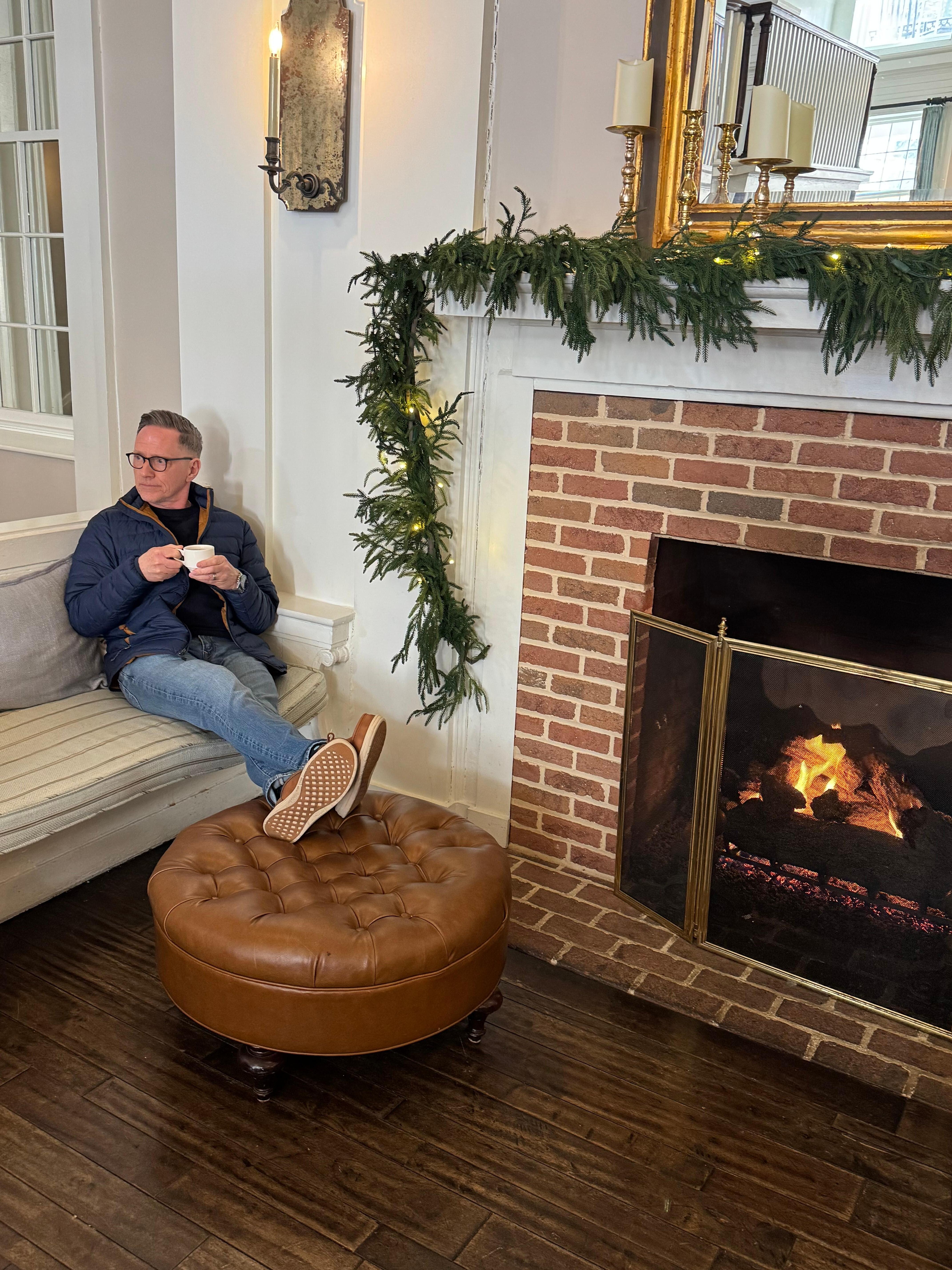 Grabbing some complementary tea and a spot by the fire.