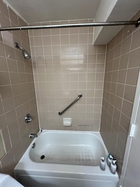 Missing tiles and shower curtain