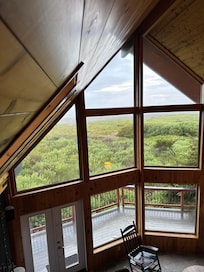Beautiful Knotty Pine interior. Nautical Prow Front architecture. Sweeping Beachfront view includes the private access. Deer and Whales in same view.