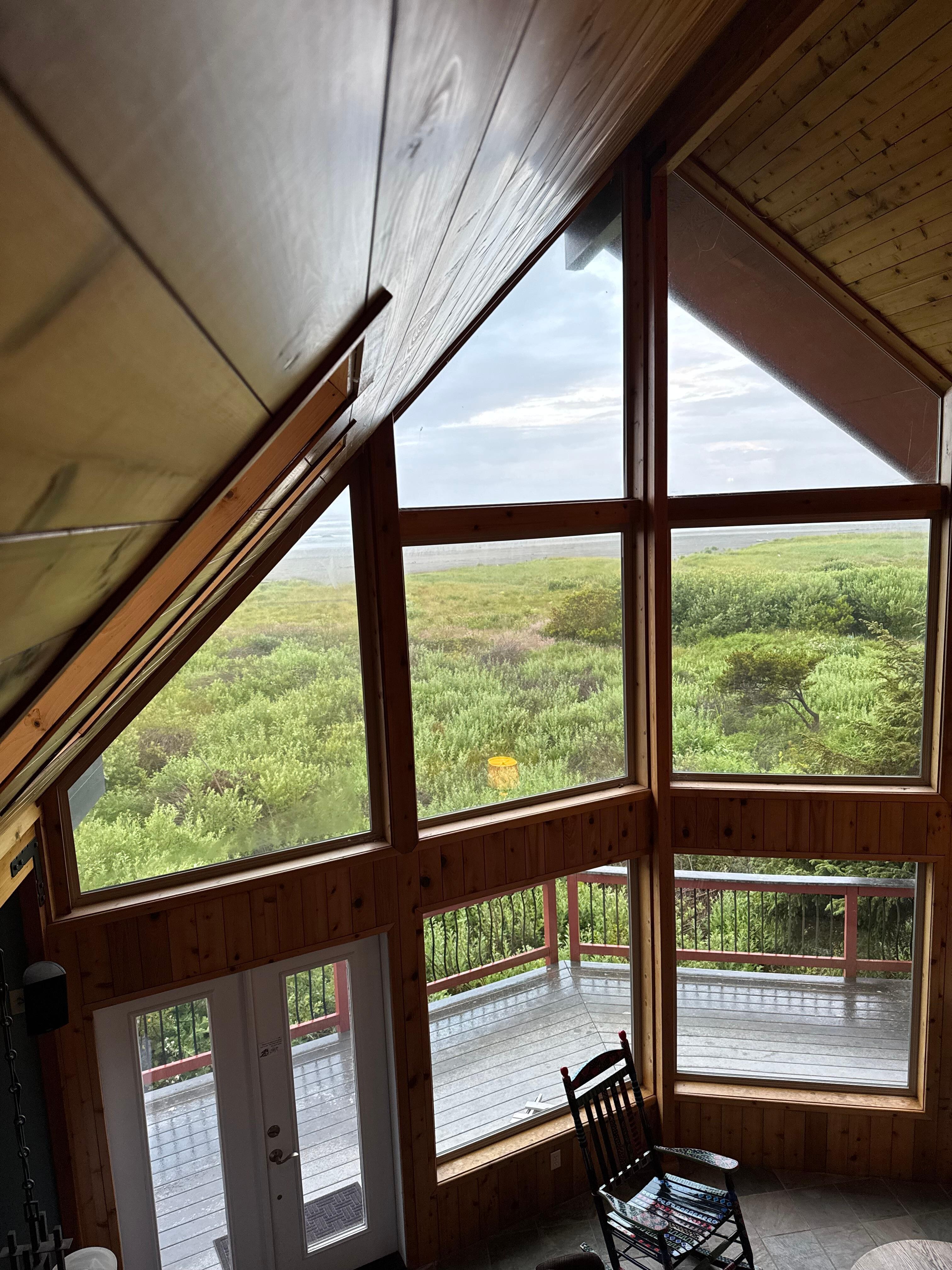 Beautiful Knotty Pine interior. Nautical Prow Front architecture. Sweeping Beachfront view includes the private access. Deer and Whales in same view.