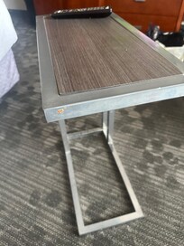Food residue, or possible dried human mucus in side table.