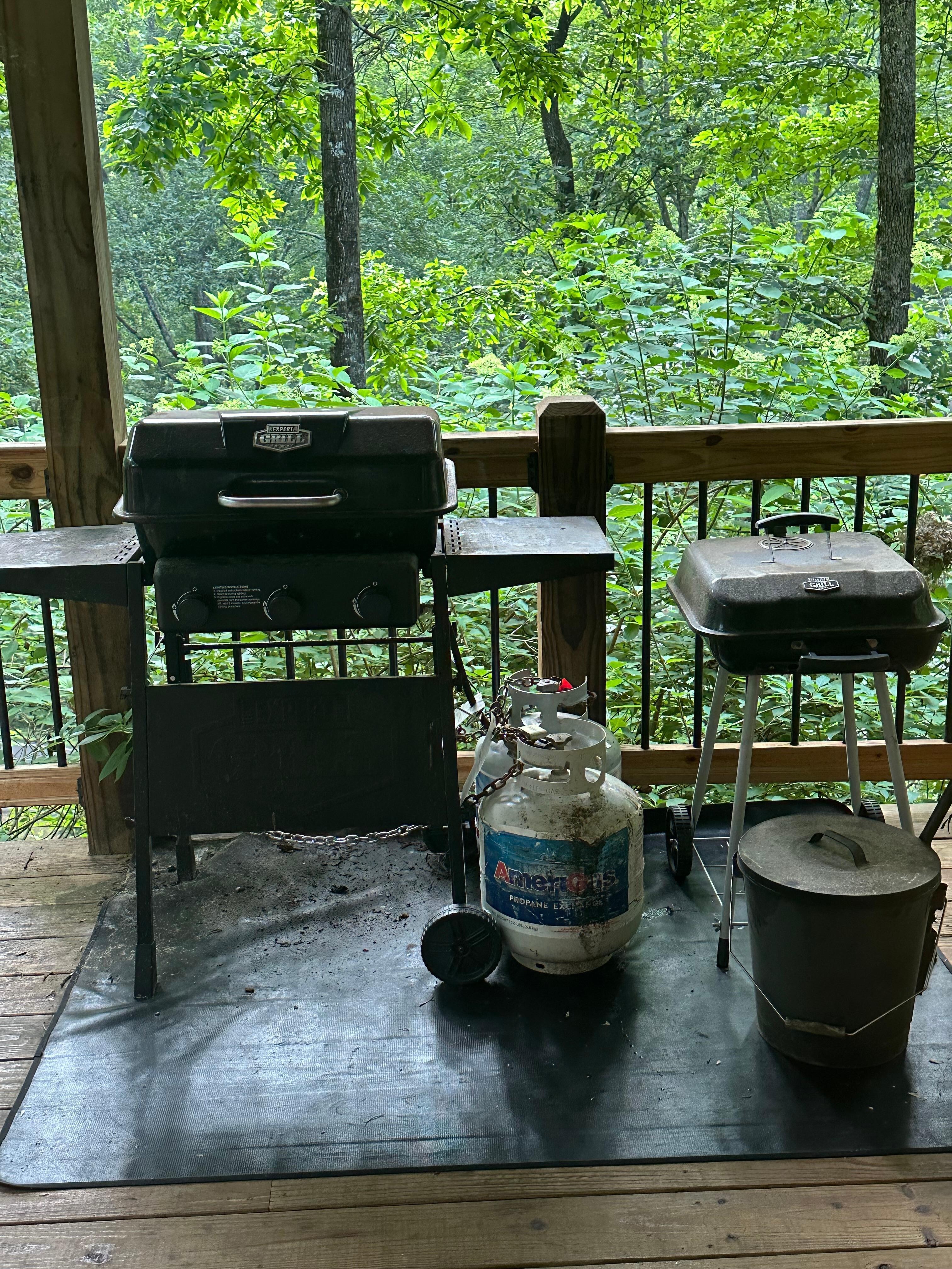 Grill area and grills dirty and covered in ash