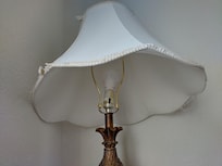 lamp with bulb base off it's mounting and unplugged.