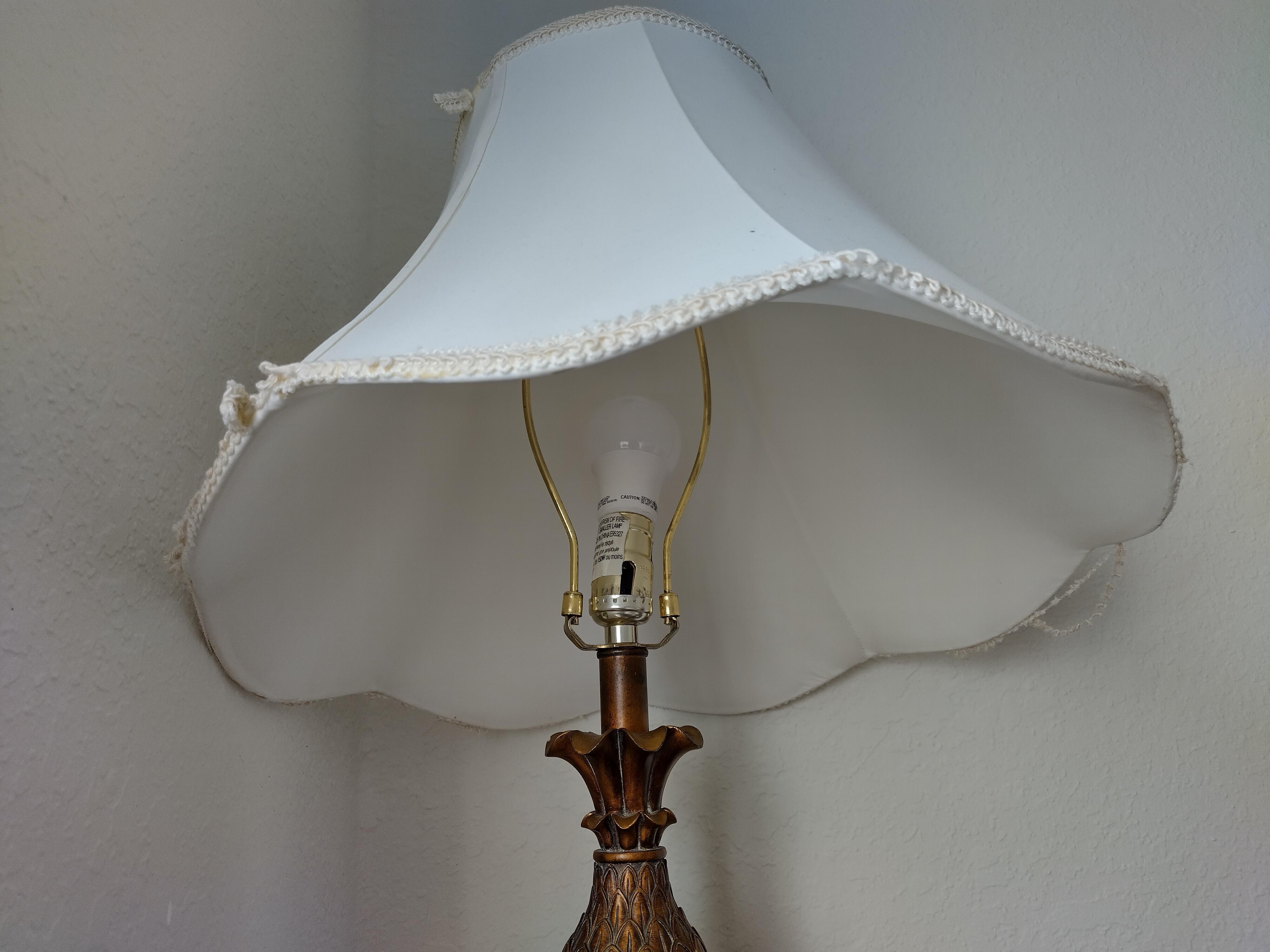 lamp with bulb base off it's mounting and unplugged.
