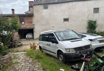 there was room to park your car, the white bus is owned by the owner, but was full of junk.