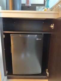 There is a fridge. But, no microwave.