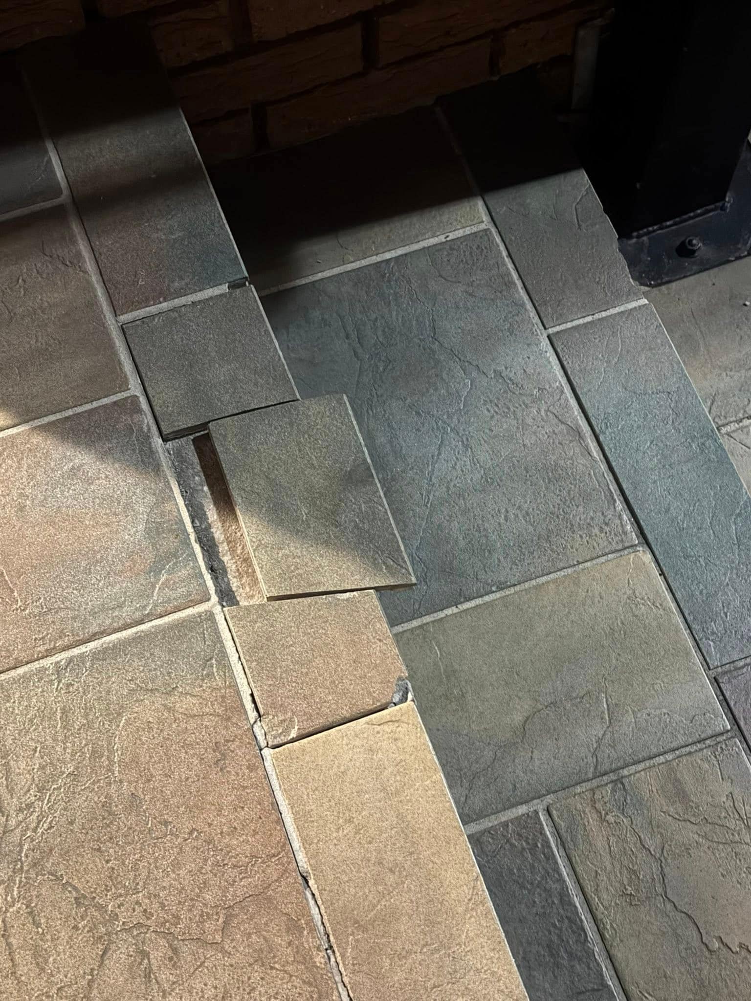 MULTIPLE LOOSE TILES AROUND PROPERTY, TRIP HAZARD