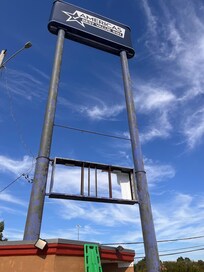 If a picture paints a thousand words, this is pretty accurate. The sign is falling apart.